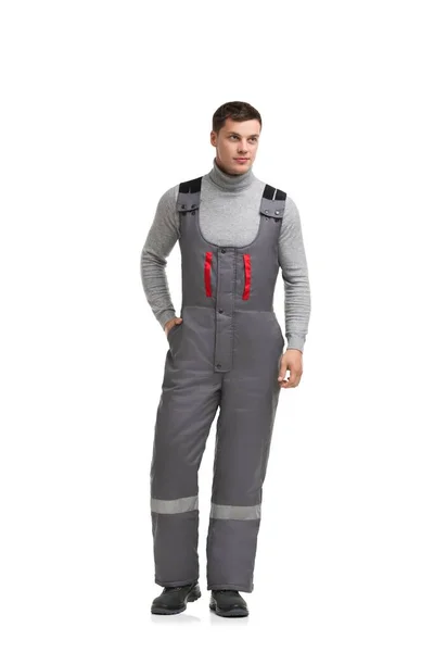 Handsome male in gray work overalls view — ストック写真
