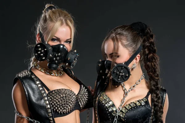 Hot dancers in studded costumes and respirators — Stock Photo, Image