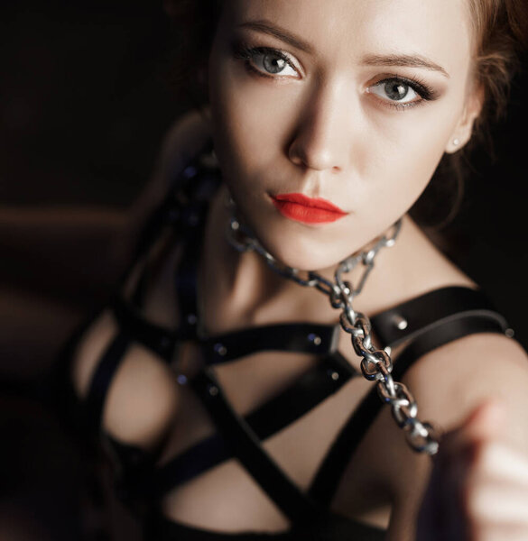 Dominatrix woman in bdsm fetish lingerie