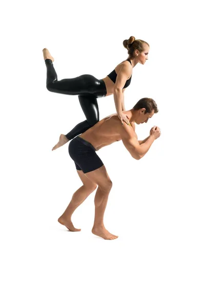 Young couple in sportswear training isolated shot — Stockfoto