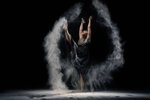 Graceful lady in underwear dancing with dust — Stock Photo, Image