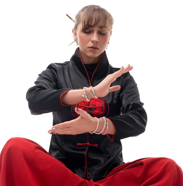 Woman practicing wushu on the floor isolated shot — Stock Photo, Image