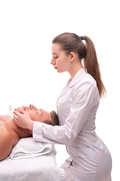 Woman doing massage on face of male client — Stock Photo, Image