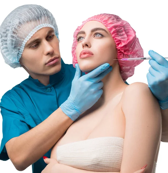 Bandaged girl at plastic surgeon shot