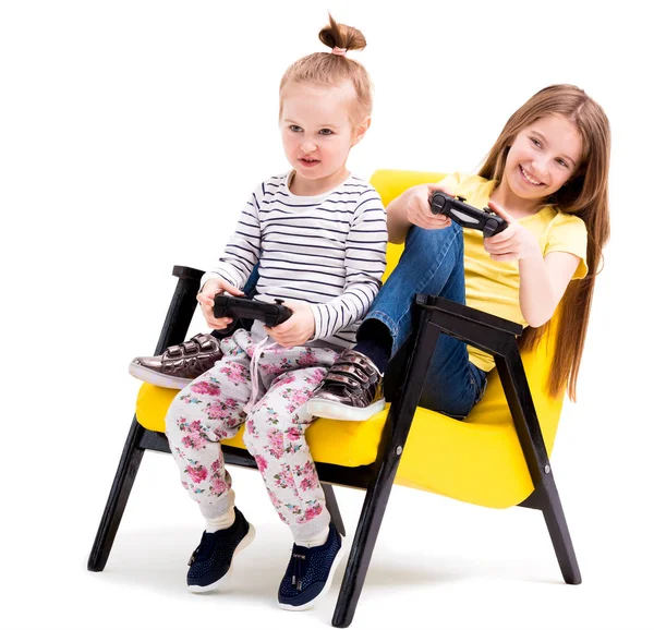 Siblings playing battles with joystick — Stock Photo, Image