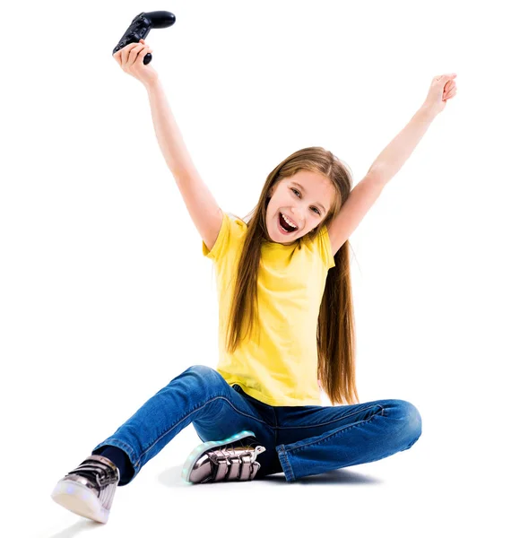 Menina jogar jogos de computador com um joypad — Fotografia de Stock