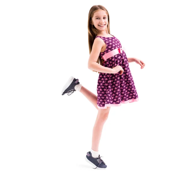 Girl in dress, posing and moving her leg — Stock Photo, Image