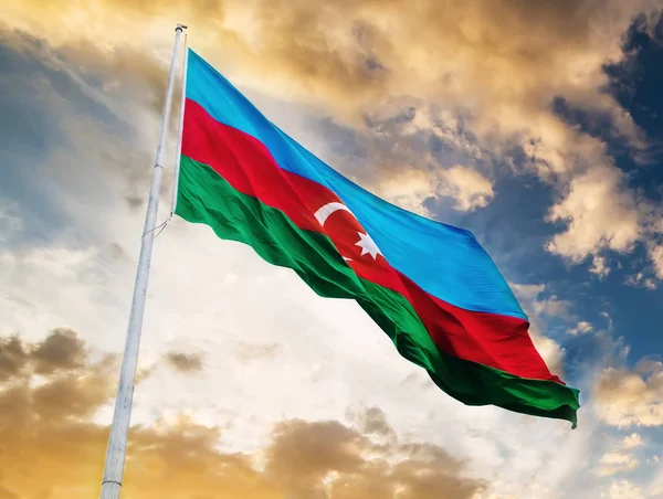 Azerbaijan flag against sunset sky — Stock Photo, Image