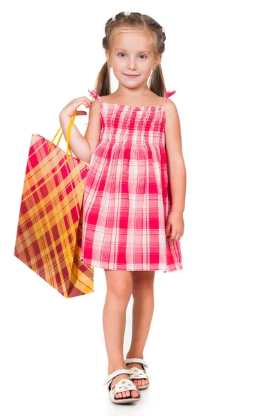 Adorable niña con bolsa de compras —  Fotos de Stock