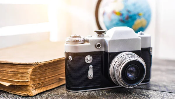 Rarity camera zenit with globe on the background — Stock Photo, Image