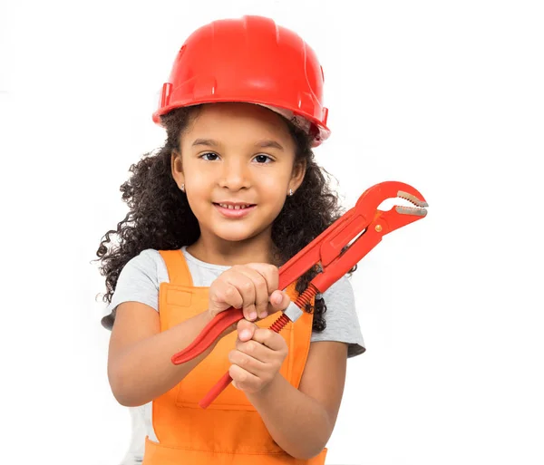 Smiling little girl-worker with pliers in hands isolated — Stock Photo, Image