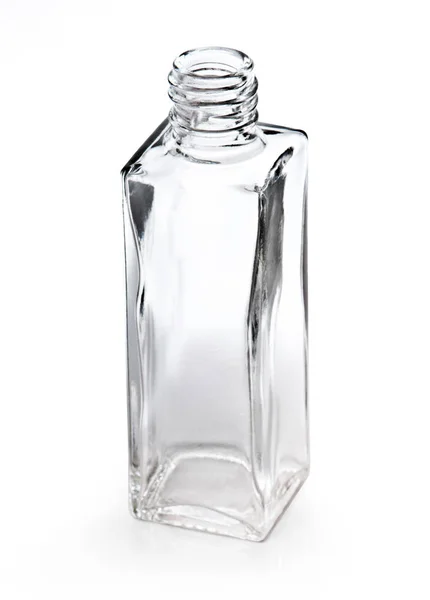 Pequena garrafa de vidro vazio isolado em branco — Fotografia de Stock