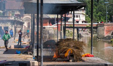 Pashupatinath temple cremations on the Bagmati River clipart