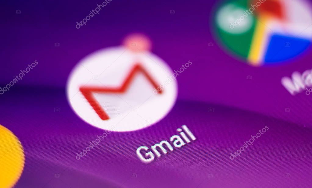 Kharkiv, Ukraine - 14 August, 2018: Closeup mobile Gmail and android google services icons on purple blurred background