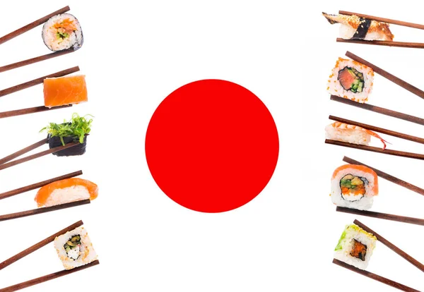 Different sushi on the background of japanese flag — Stock Photo, Image