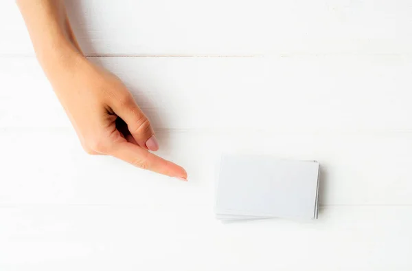 Black business card in girl hands — Stock Photo, Image