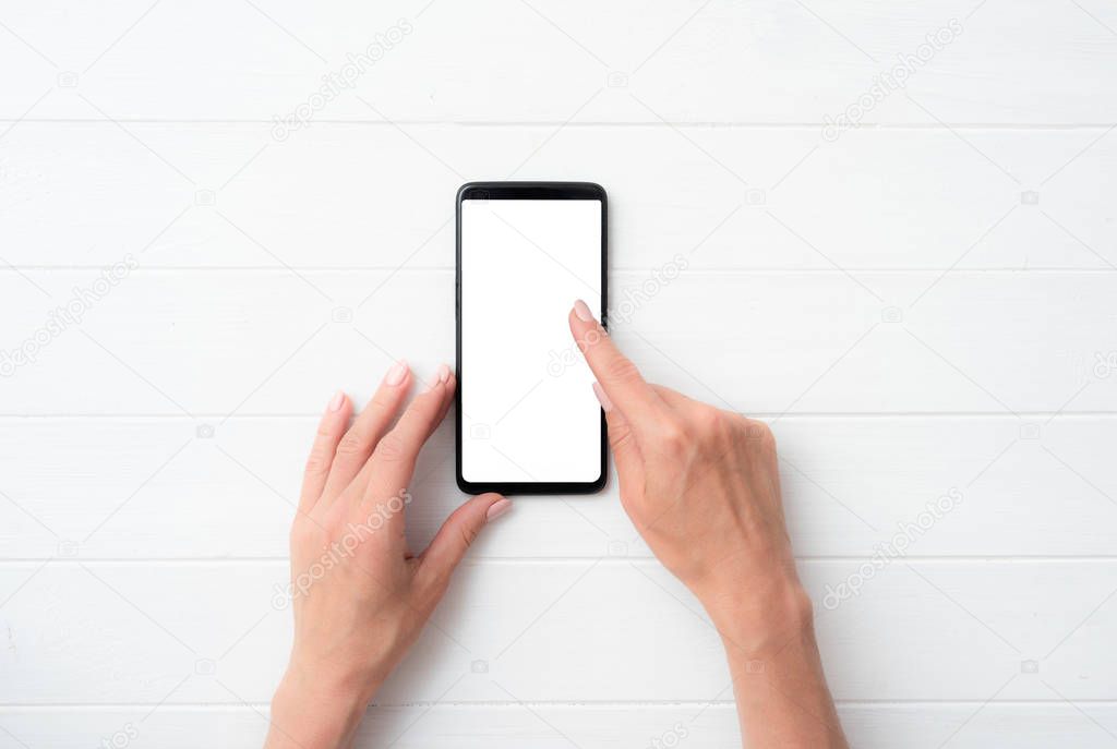 Mock up of user hands with black smartphone for your design