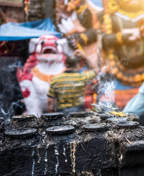 Smoke from candles with blurred people on the background — Stock Photo, Image