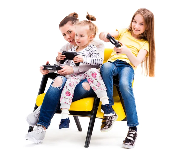 Mom and daughters playing console — Stock Photo, Image