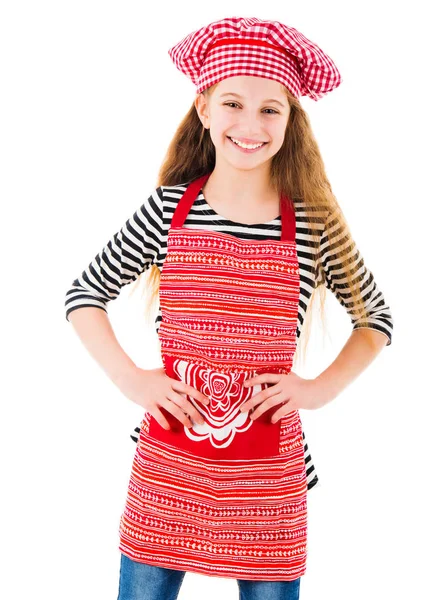 Little girl in red chef uniform smiles — Stock Photo, Image