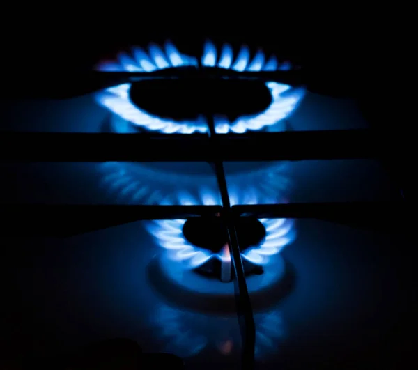 Gas burner in dark room — Stock Photo, Image