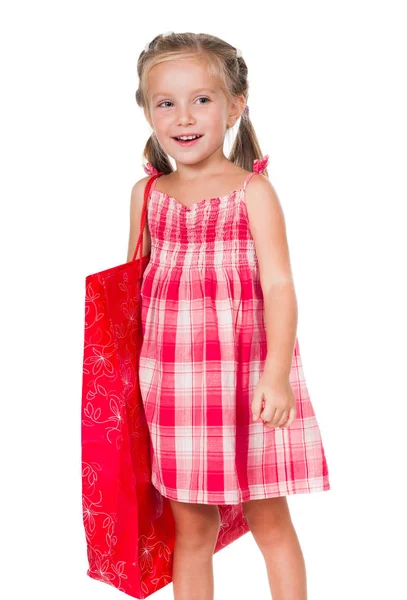 Alışveriş çantası ile gülümseyen küçük kız — Stok fotoğraf