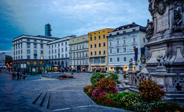 Architecture and flowerbed at the central square in Linz,Austria clipart
