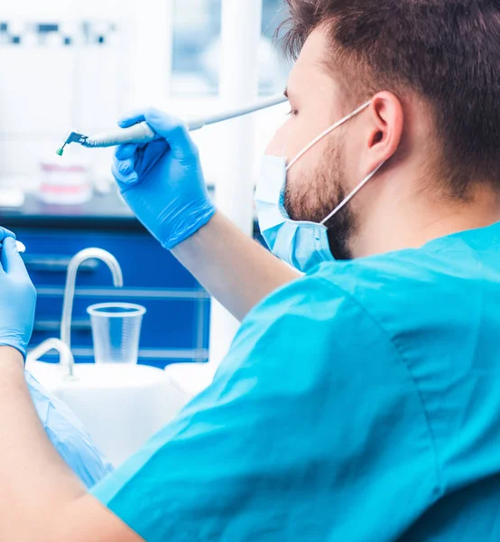 Dentist treating patient