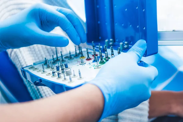 Closeup of doctors hands taking equipment — Stock Photo, Image