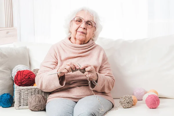 Grandmother knitting at home — Stock Photo, Image