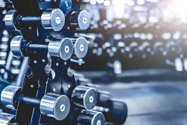 Rack with a set of dumbbells — Stock Photo, Image