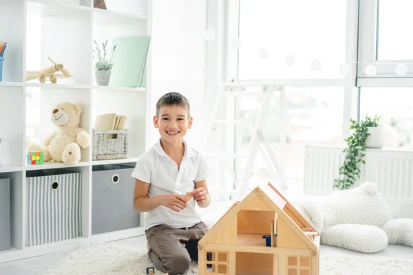 Happy little boy playing with toys — Stock Photo, Image
