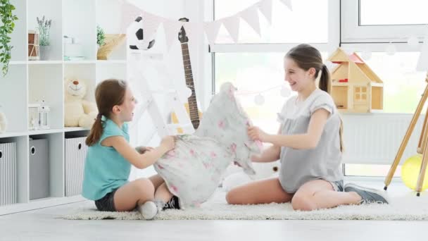 Happy children girls having pillow fight — Stock Video