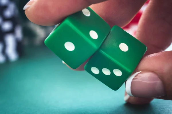 Green dice in woman hand — Stock Photo, Image