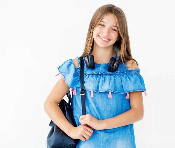 Child with headphones and backpack — Stock Photo, Image