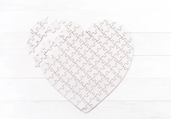 Puzzle in form of heart — Stock Photo, Image
