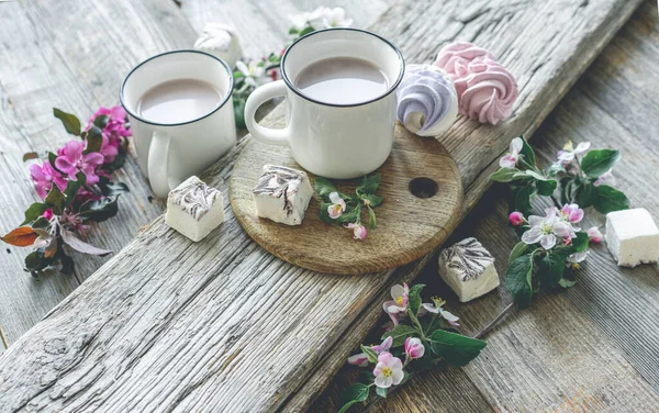 Cups with cocoa and marshmallows