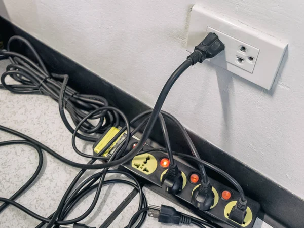 Too many plugs in a socket / Danger of using too much electricity