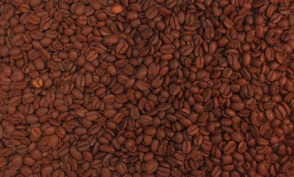 焙煎コーヒー豆の背景。コーヒー飲料用のアロマカフェイン飲料成分。クローズアップ落ち着いた色調の茶色のテクスチャ. — ストック写真