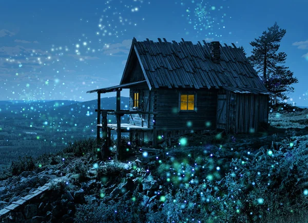 在拉普兰的圣诞老人秘密小屋下跌顶部周围的魔术灯点 — 图库照片