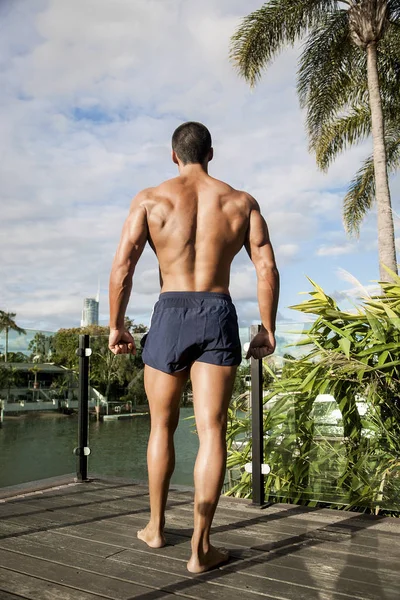Fitness trainer standing on wooden floor — Stock Photo, Image