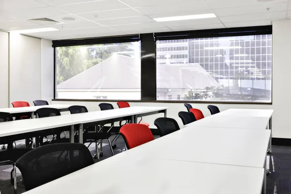 Class or conference room with glass windows showing outside