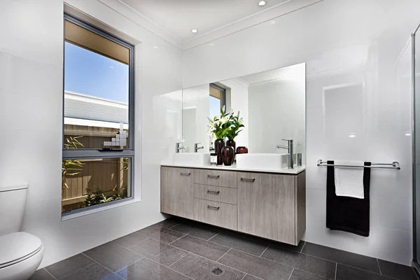 Luxury washroom with a window beside a bowl — Stock Photo, Image