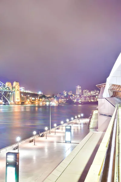 Sydney city street lamps on and illuminating the area