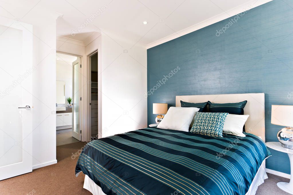 Close up of a blue decorative bedroom to an entrance 