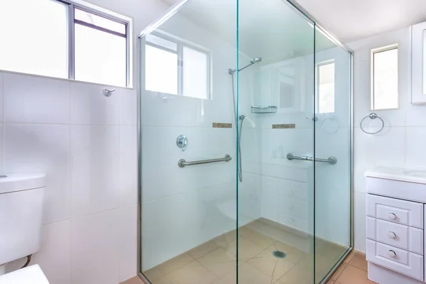 Spacious shower cabin with handles — Stock Photo, Image