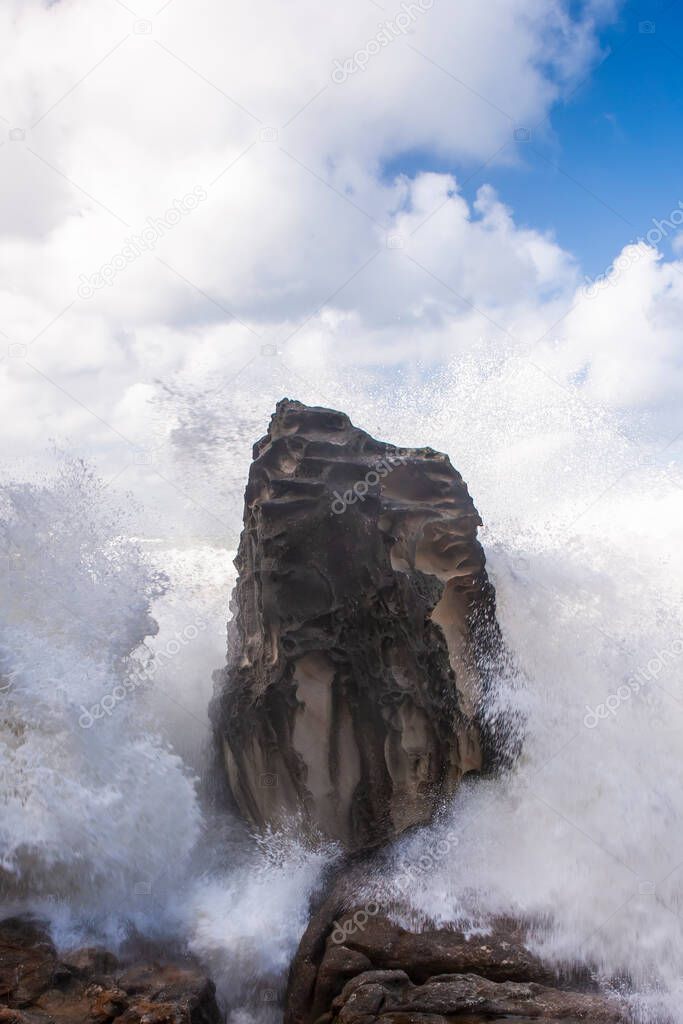 Storm waves crashing on the rocks, Bondi Australia. Stormy sea at bondi beach, Sydney, Australia. Fresh wind and splashing ocean at the coastline of the pacific