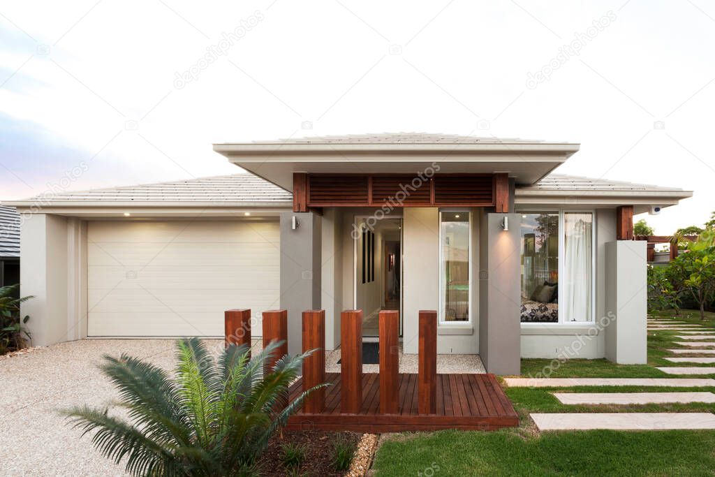 Front view of a modern house with with garage. Real estate, housing, family, new life concepts