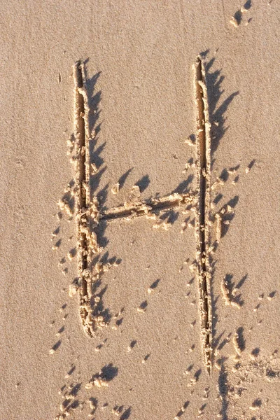H - Alphabet letter written on sand — Stock Photo, Image