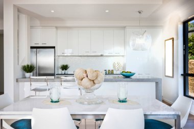 Modern bir mutfak ve yemek odası.